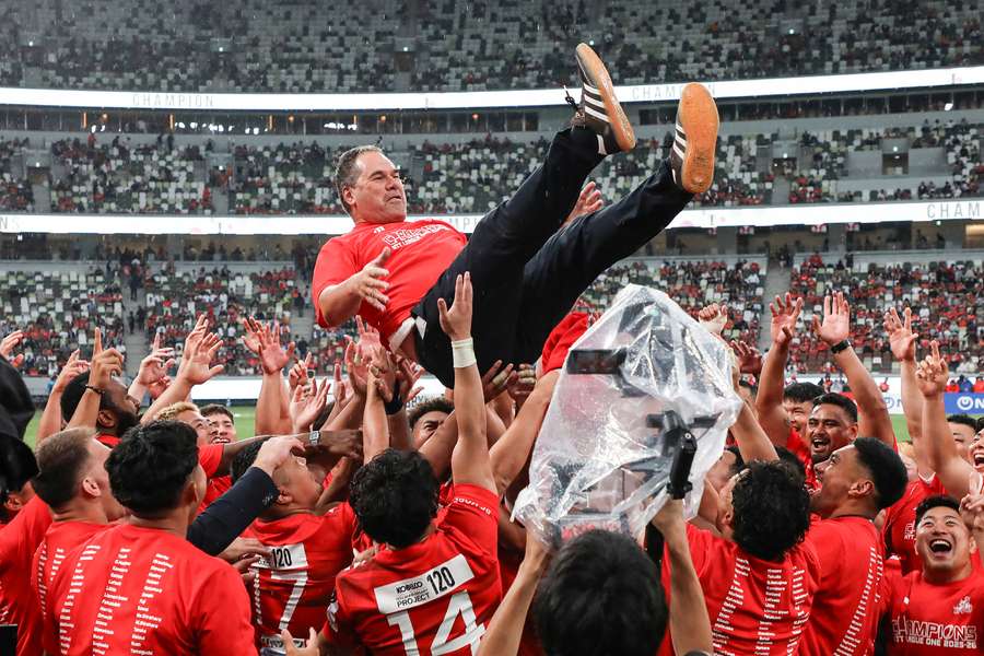 Dave Rennie is thrown into the air by his Kobe Steelers players after their League One title win in June.