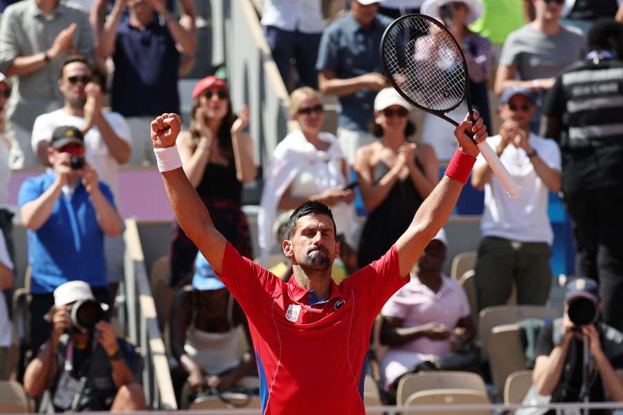 Novak Djokovic of Serbia celebrates after winning his match against Rafael Nadal of Spain