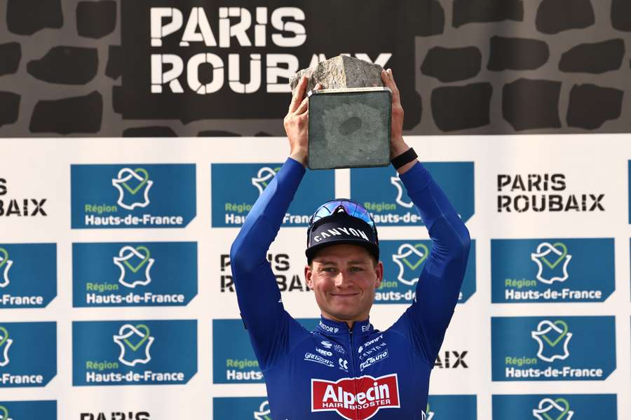 Mathieu van der Poel poses after winning at Paris-Roubaix