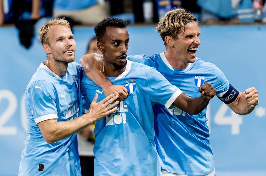 Taha Ali (centre) and teammates after his second goal of the night