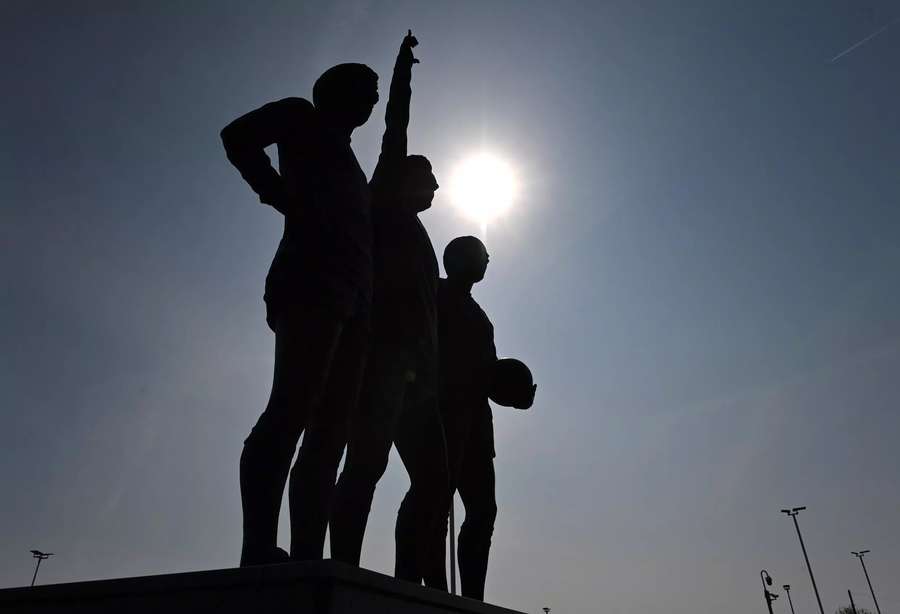 A statue of Manchester United's 'Holy Trinity' of George Best, Bobby Charlton and Denis Law outside Old Trafford