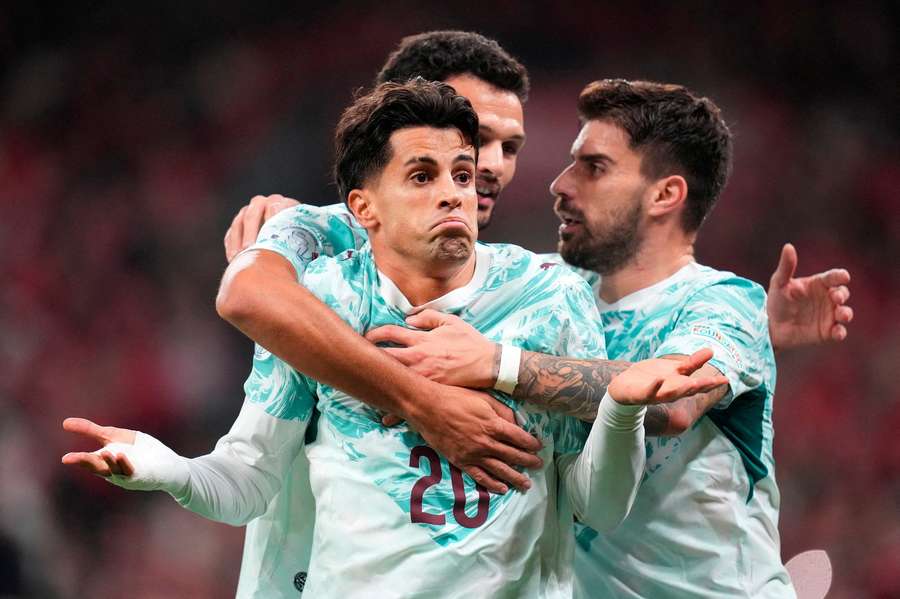 Portugal's Joao Cancelo celebrates scoring their first goal 