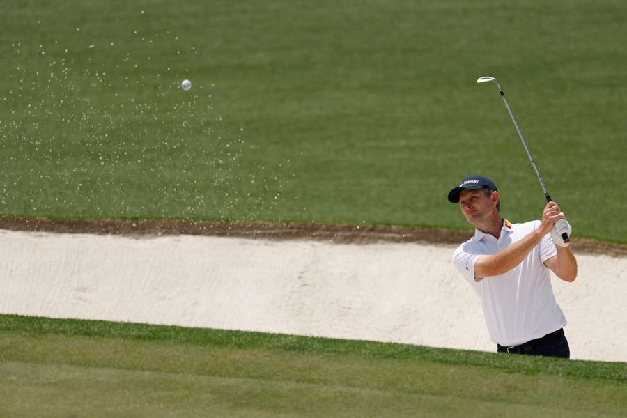 Justin Rose plays a shot from the bunker on the 17th hole on the second round of the Masters