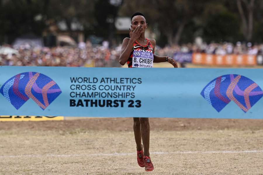 Chebet crosses the line to win the women's race