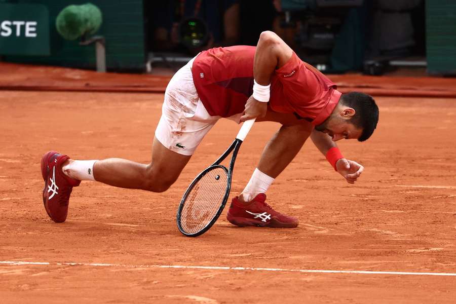 Novak Djokovic falls during his round of 16 clash at the French Open