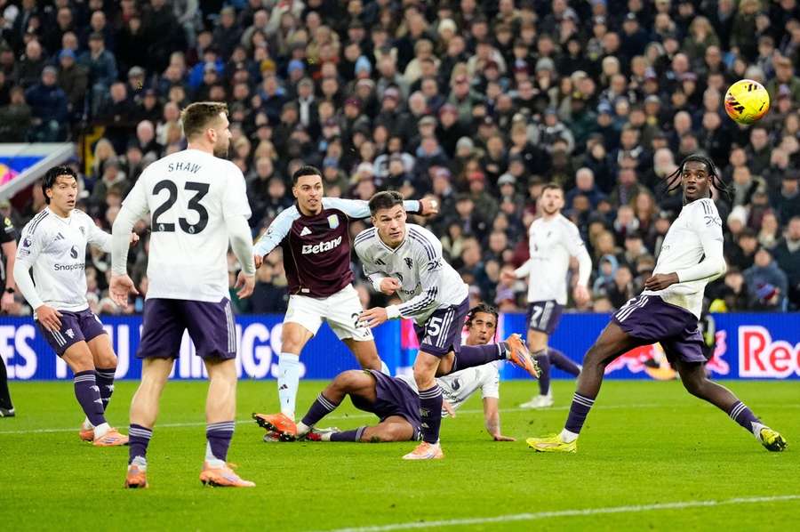 Aston Villa's Morgan Rogers (third left) scores his second goal against Man Utd