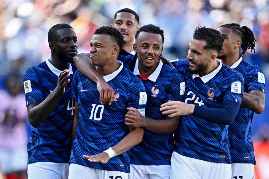 Kylian Mbappe celebrates after scoring France's third goal against Senegal