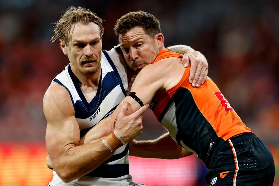 Former GWS Giants captain Toby Greene wrestles with new teammate Tom Stewart.