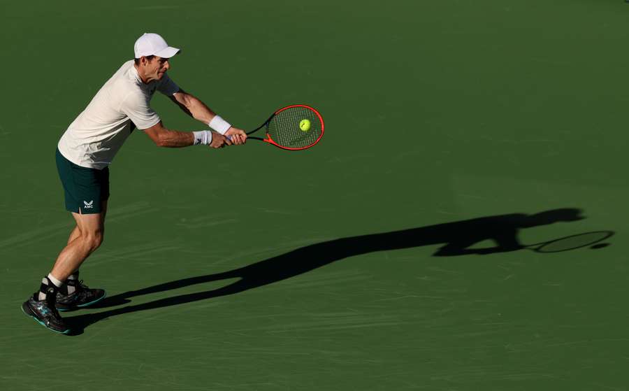 Andy Murray of Great Britain plays a backhand against Tomas Martin Etcheverry of Argentina