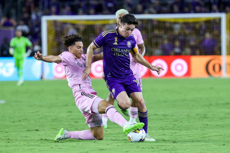 Inter Miami's David Ruiz tackles Mauricio Pereyra of Orlando City