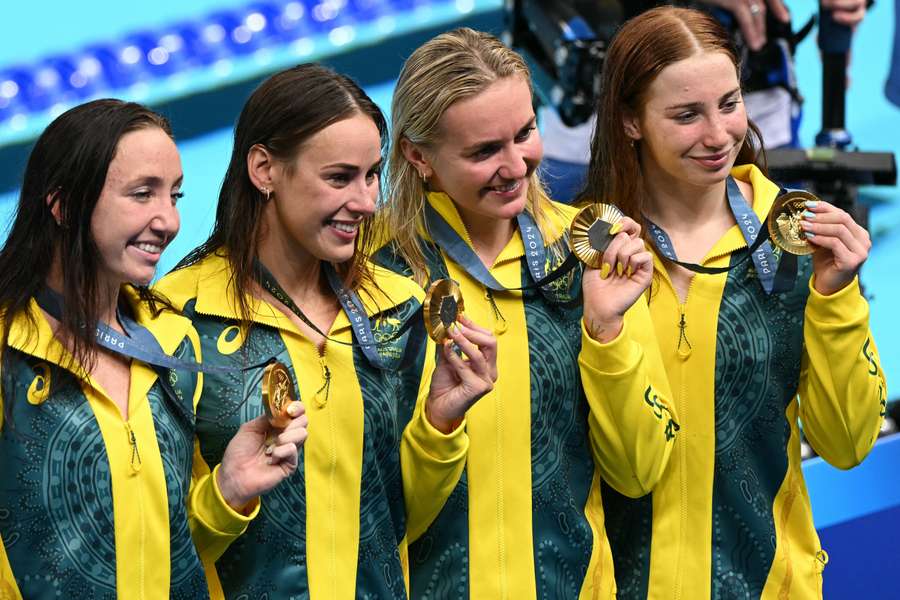 Australia's Mollie O'callaghan, Australia's Lani Pallister, Australia's Brianna Throssell and Australia's Ariarne Titmus pose with their medals 