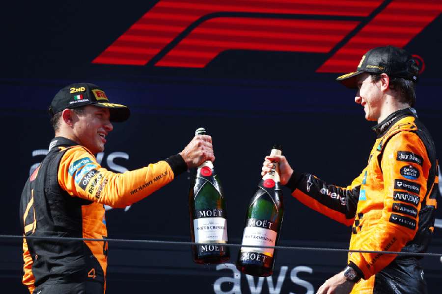 Norris and Piastri celebrate on the podium together Norris and Piastri celebrate on the podium together