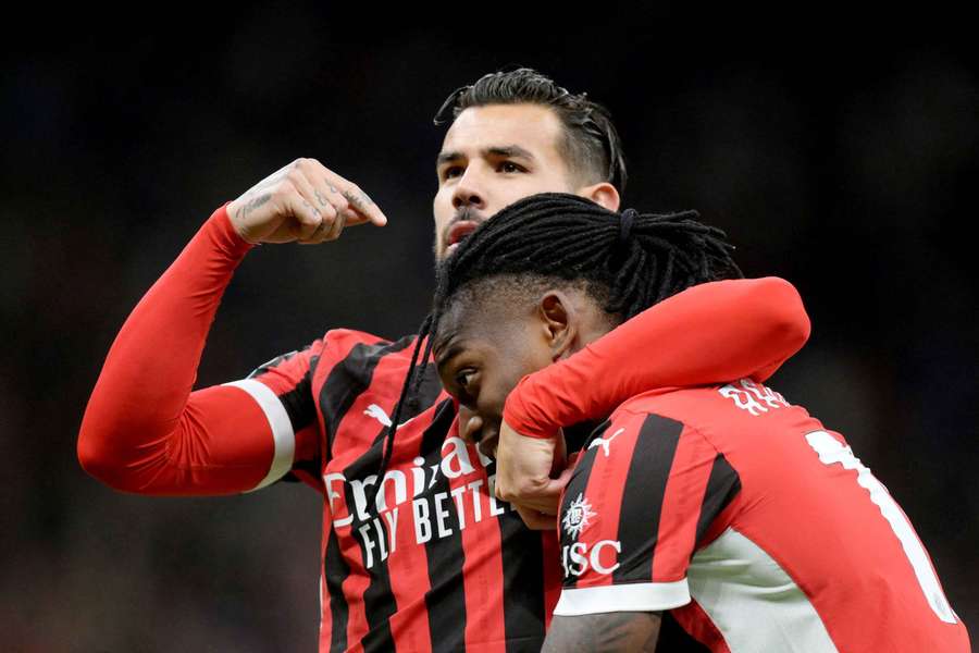 AC Milan's Theo Hernandez celebrates a goal with Rafael Leao