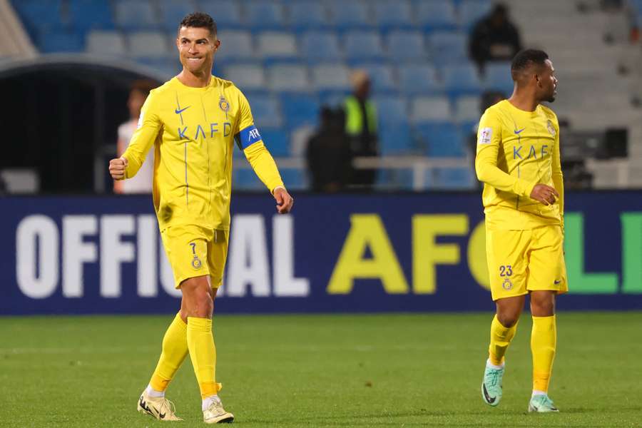 Al Nassr's spits Cristiano Ronaldo (L)