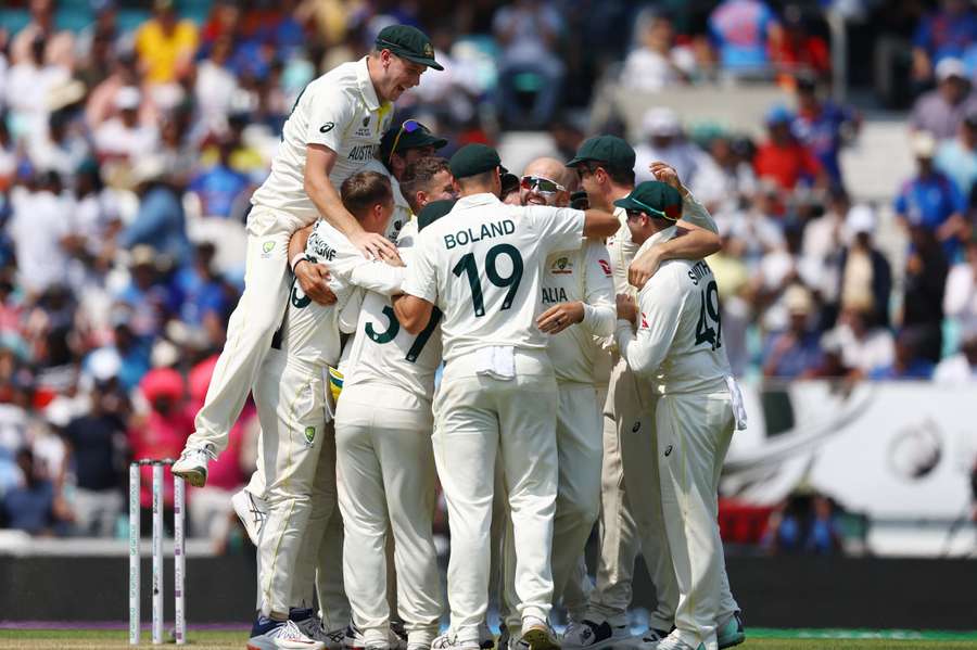 Australia celebrate their victory over India