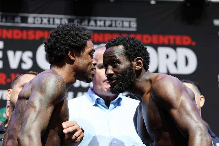 Errol Spence Jr. talks with Terrence Crawford during their weigh-in at T-Mobile Arena