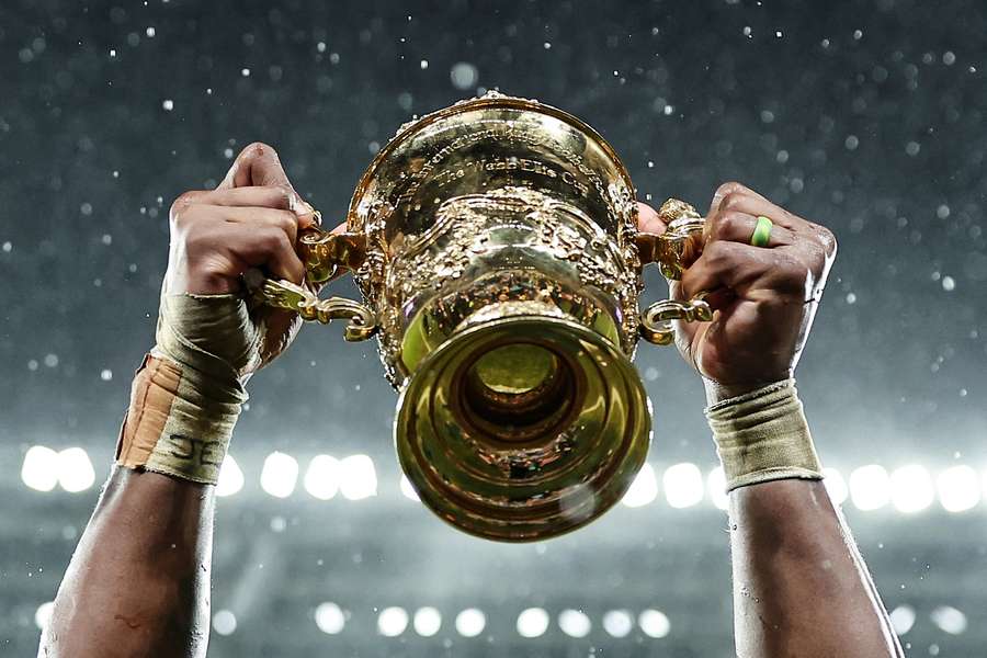 The Webb Ellis Cup is lifted by South Africa's flanker and captain Siya Kolisi as he celebrates winning the France 2023 Rugby World Cup final The Webb Ellis Cup is lifted by South Africa's flanker and captain Siya Kolisi as he celebrates winning the France 2023 Rugby World Cup final