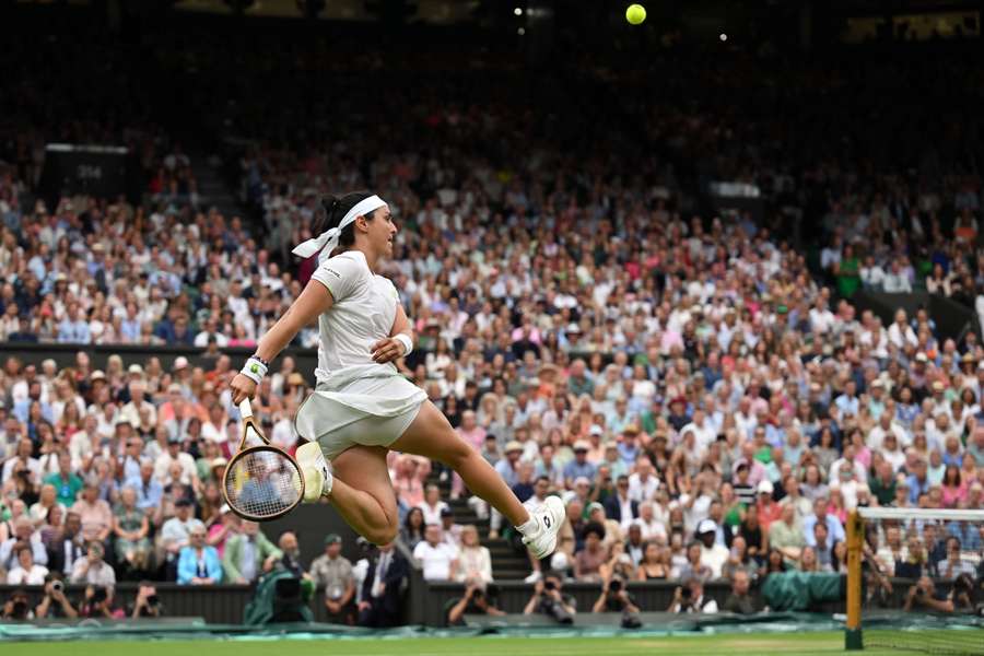 Ons Jabeur kicks the ball during her win over Aryna Sabalenka