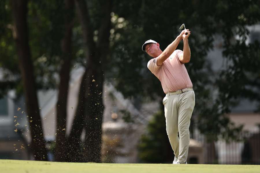 Glover plays a shot on the 13th hole