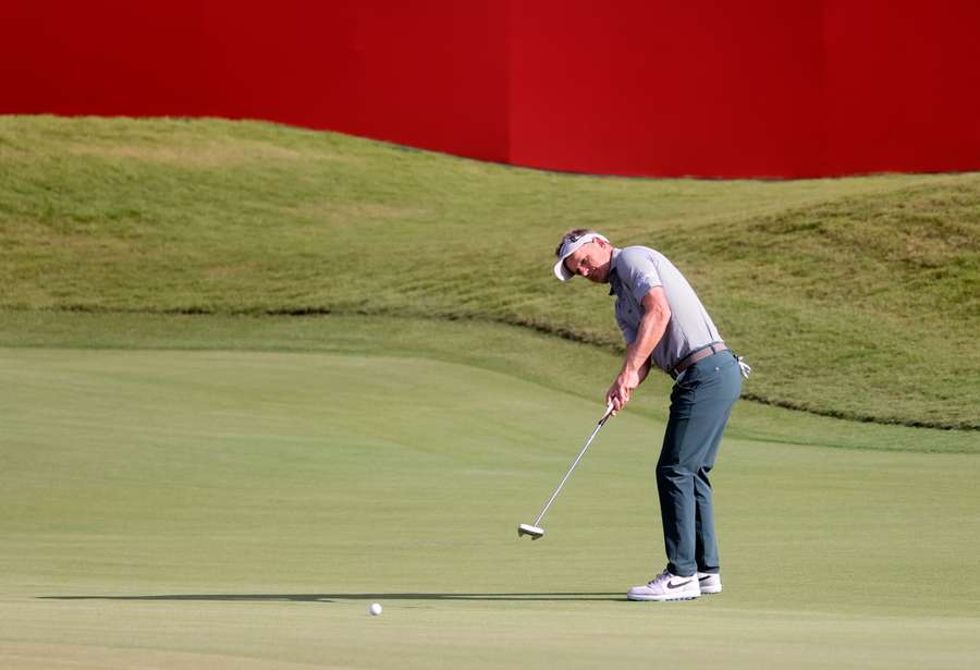 Luke Donald plays a shot during the Abu Dhabi HSBC Golf Championship