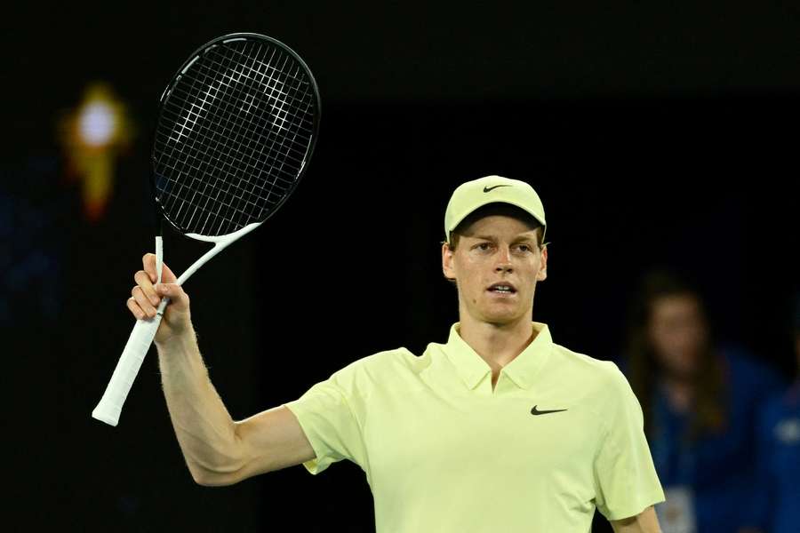 Jannik Sinner acknowledges the crowd following victory against Marcos Giron