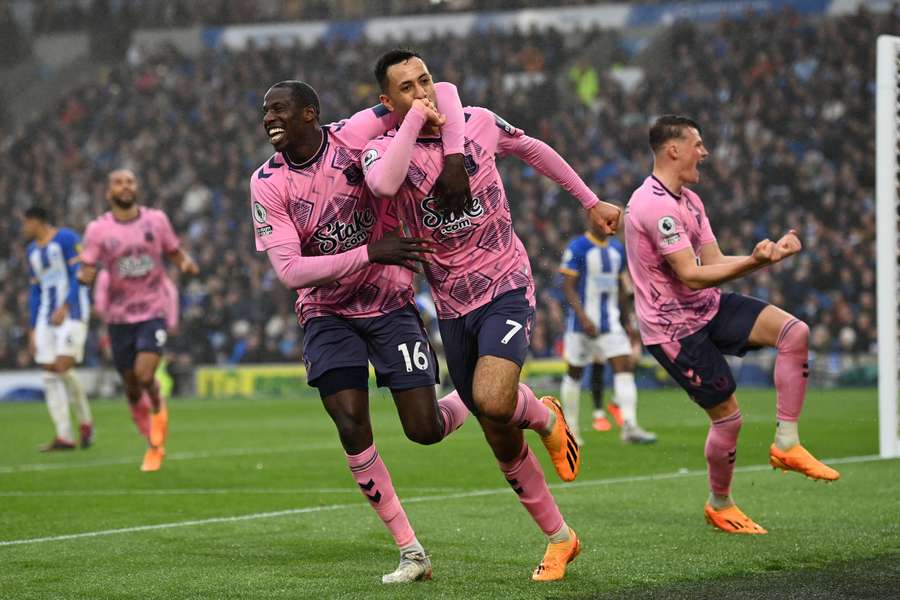 McNeil (C) celebrates his goal