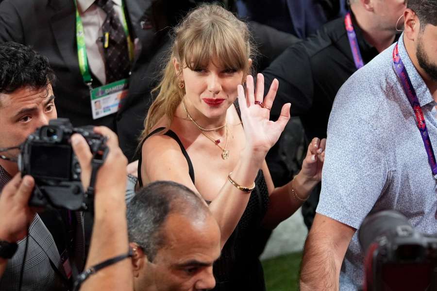 Taylor Swift moves on the field after Super Bowl LVIII between the San Francisco 49ers and Kansas City Chiefs