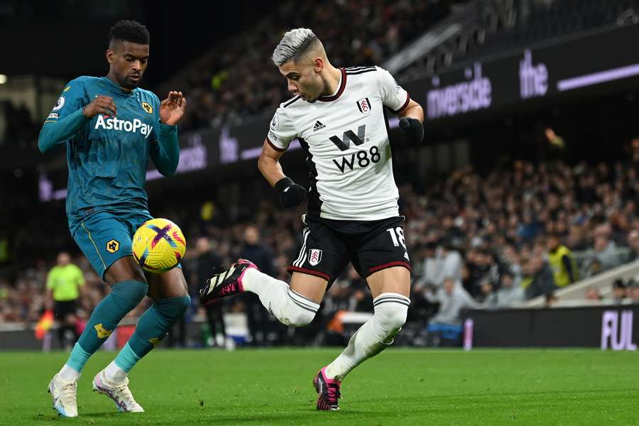 Fulham's Brazilian midfielder Andreas Pereira vies with Wolverhampton Wanderers' Portuguese defender Nelson Semedo 