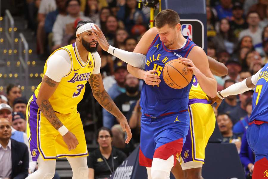 Nikola Jokic of the Denver Nuggets fights for a rebound against the Los Angeles Lakers