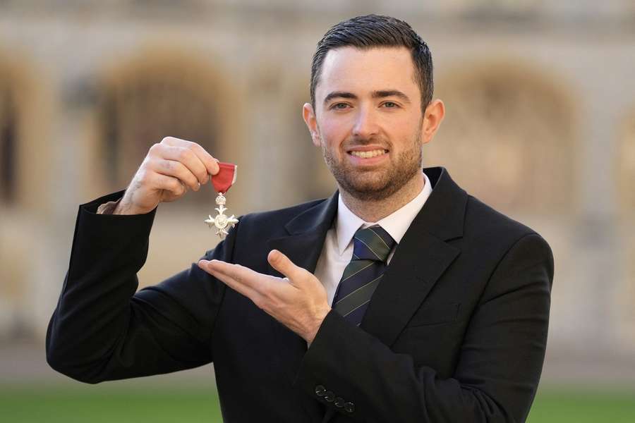 Luke Humphries poses after being made a Member of the Order of the British Empire (MBE) following an investiture ceremony at Windsor Castle Luke Humphries poses after being made a Member of the Order of the British Empire (MBE) following an investiture ceremony at Windsor Castle