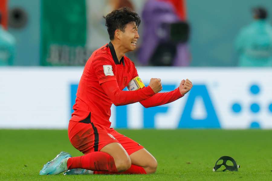 Son Heung-min celebrates after South Korea beat Portugal to progress to the last 16.