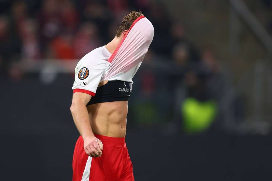 FC Utrecht's Dani de Wit covers his face in disappointment following the 2-1 loss to Nottingham Forest