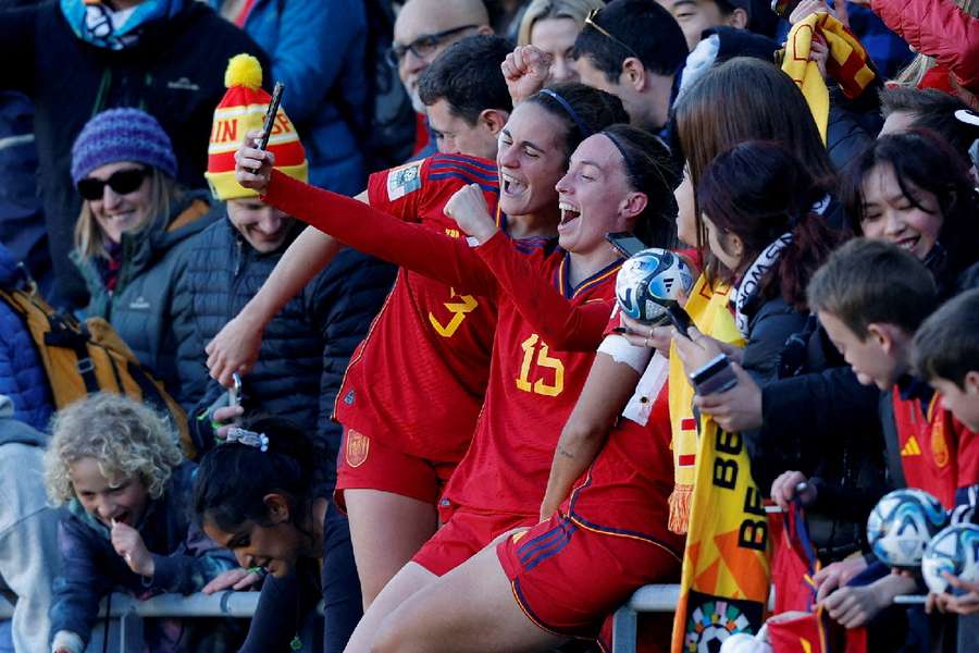 Spain's Teresa Abelleira and Eva Navarro celebrate with fans after progressing to the semi-finals of the World Cup
