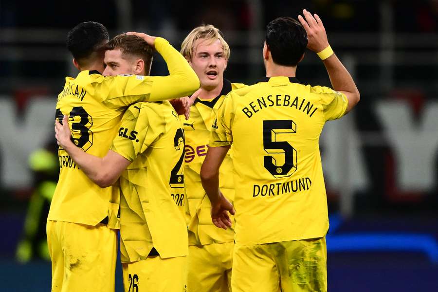 Dortmund celebrate after qualifying for the last-16