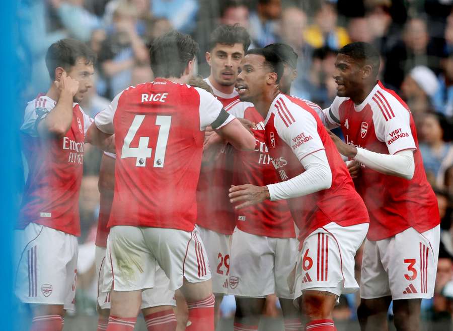 Arsenal's players react to their leveller