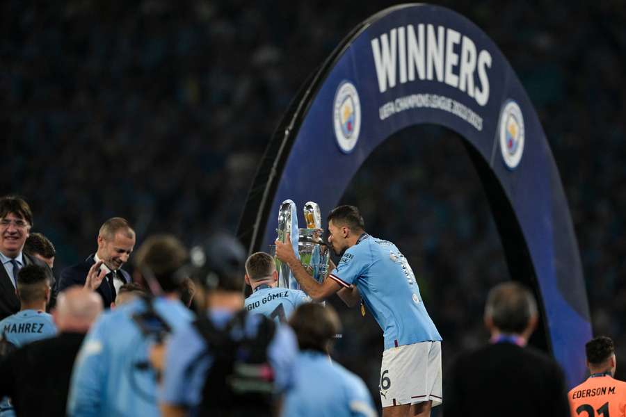 Rodri kisses the Champions League trophy