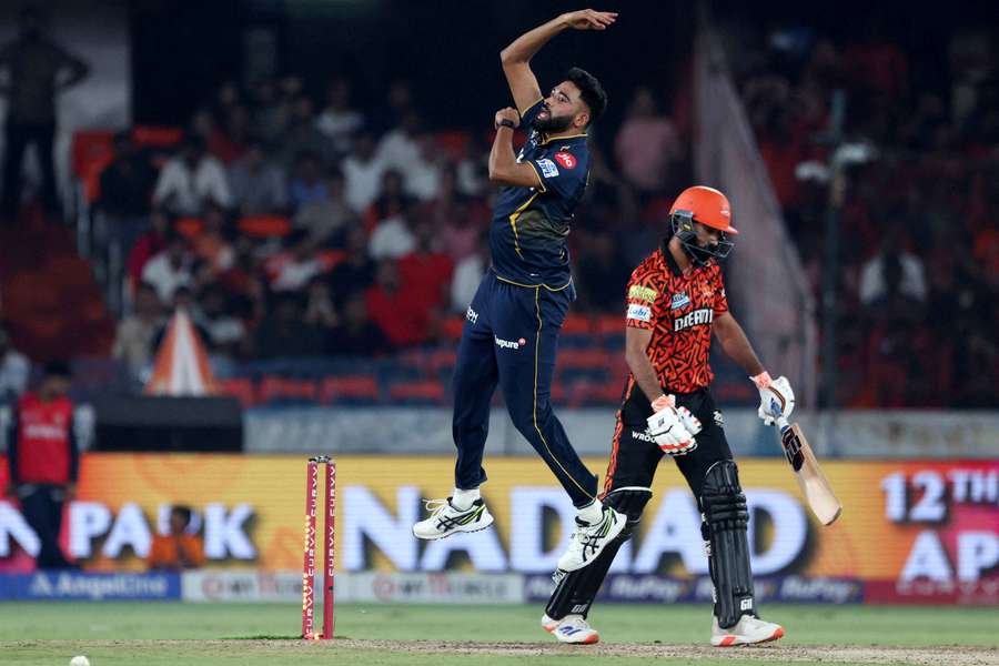 Gujarat Titans' Mohammed Siraj celebrates after taking the wicket of Sunrisers Hyderabad's Simarjeet Singh
