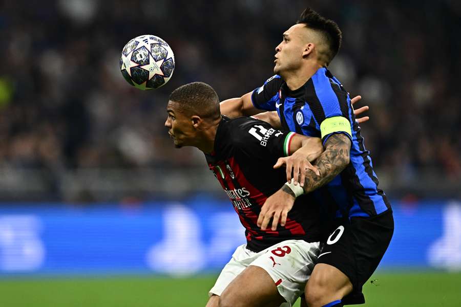 AC Milan's Malick Thiaw and Inter's Lautaro Martinez go for the ball