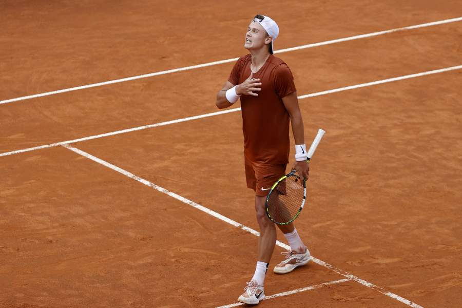 Holger Rune celebrates the win