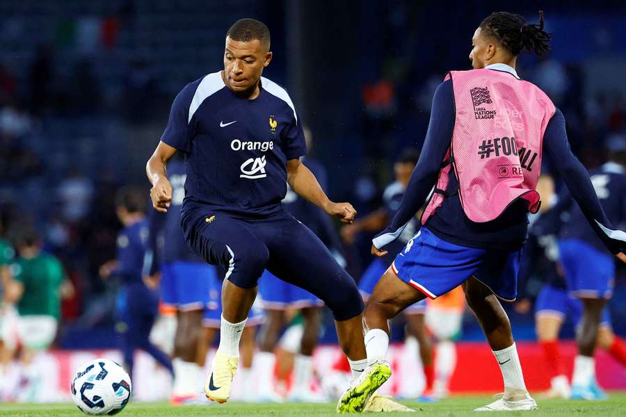 France's Kylian Mbappe and Michael Olise during a warm-up