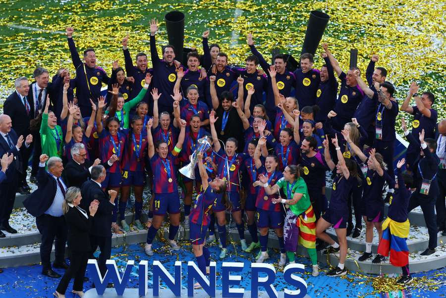 Barcelona's players celebrate with the trophy Barcelona's players celebrate with the trophy