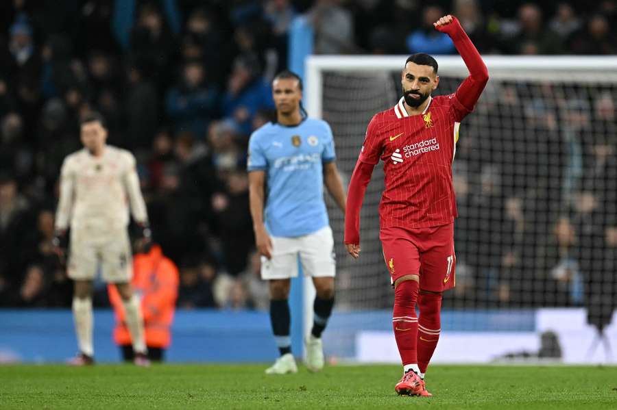 Mohamed Salah celebrates scoring the opening goal against Man City