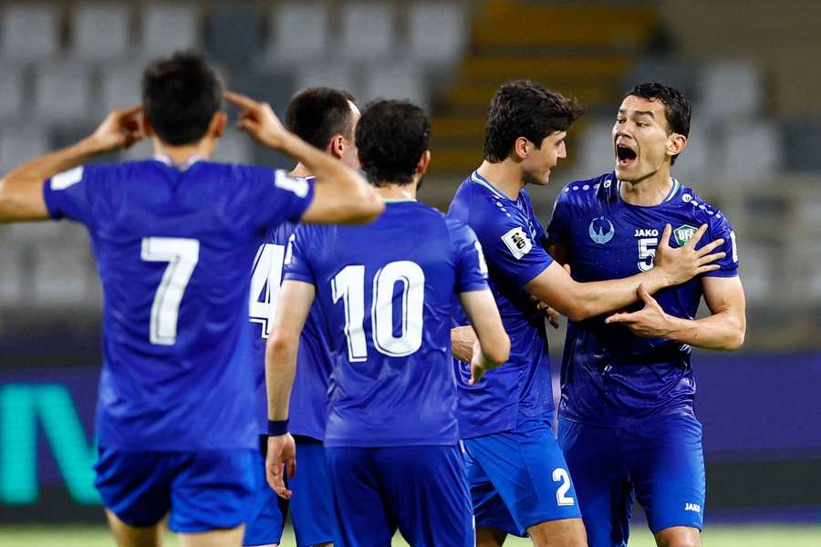 Uzbekistan's players come together during the goalless draw