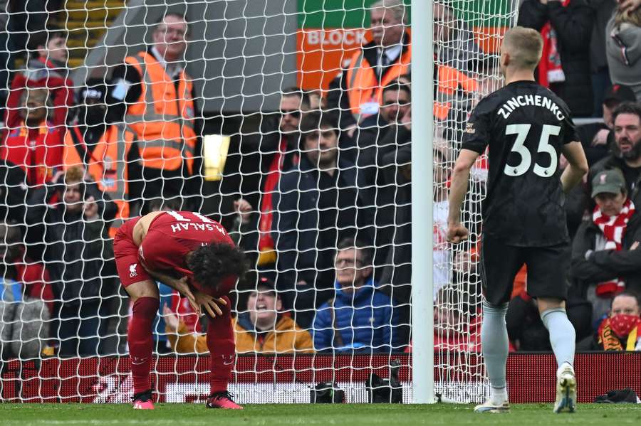 Mohamed Salah reacts after missing his penalty