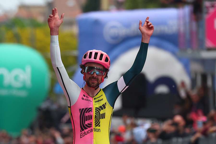 Ben Healy celebrates as he crosses the finish line