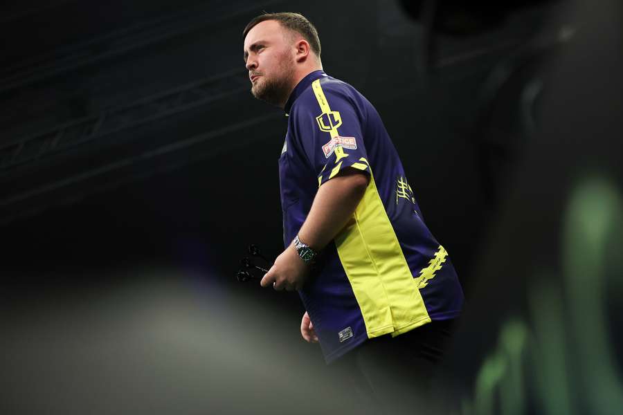 Littler in action at the Grand Slam of Darts