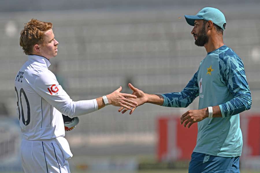 England captain Ollie Pope shakes hands with Pakistan counterpart Shan Masood