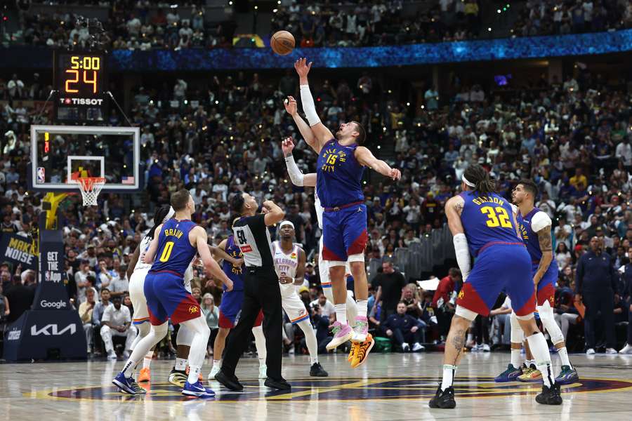 Nikola Jokic of the Denver Nuggets jumps for the ball against Isaiah Hartenstein of the Oklahoma City Thunder during overtime
