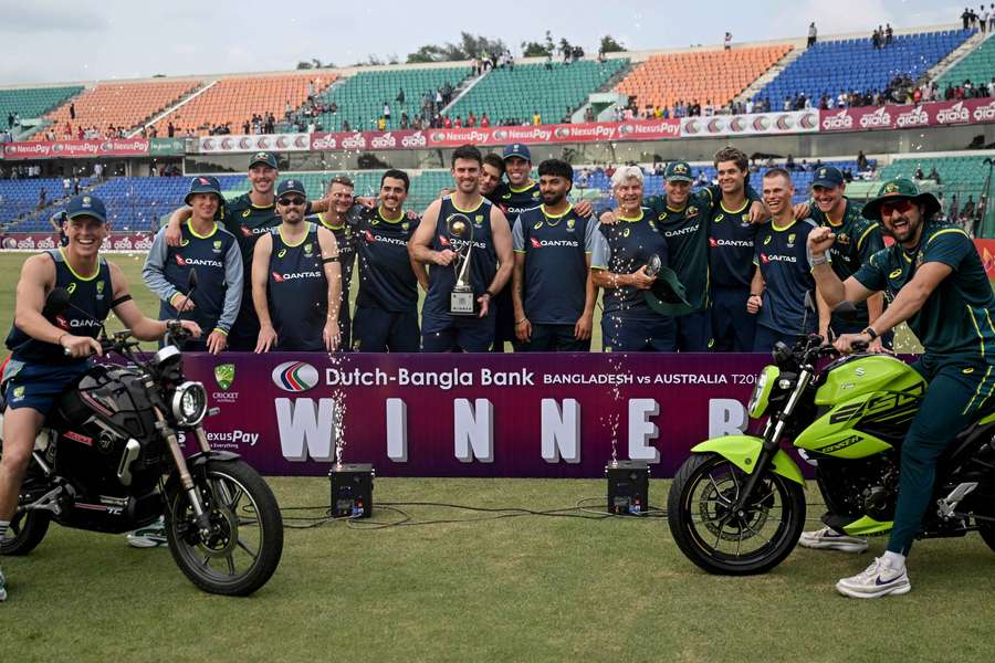 Australia's captain Mitchell Marsh (centre) holds the series trophy alongside teammates Australia's captain Mitchell Marsh (centre) holds the series trophy alongside teammates