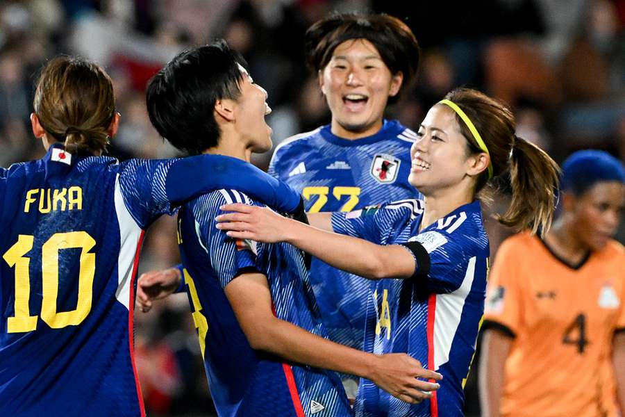 Japan's forward #09 Riko Ueki celebrates after scoring a penalty and the team's fifth goal 